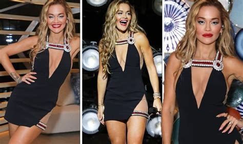 Rita Ora Puts On Busty Display In Plunging Dress While Displaying