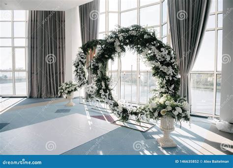 Wedding Arch And Indoor Wedding Ceremony Decoration Of The Wedding
