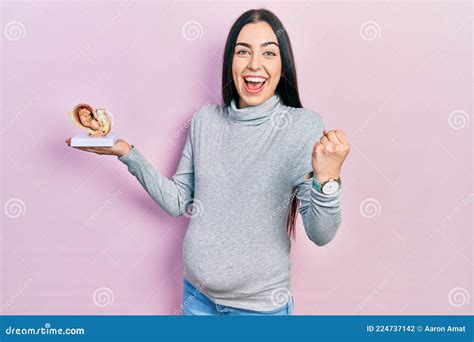 Beautiful Woman With Blue Eyes Expecting A Baby Holding Anatomic Fetus