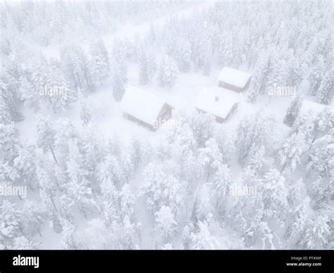 Aerial View Of Huts In The Snow Covered Forest Levi Kittila Lapland