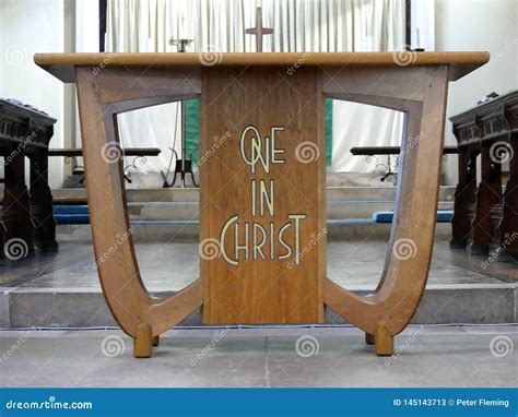 Wooden Church Table Inscribed With The Words One In Christ Stock Image