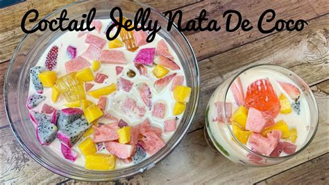 While the mix is still hot, pour into prepared moulds containing longan and nata de coco. Coctail Jelly Nata De Coco - YouTube
