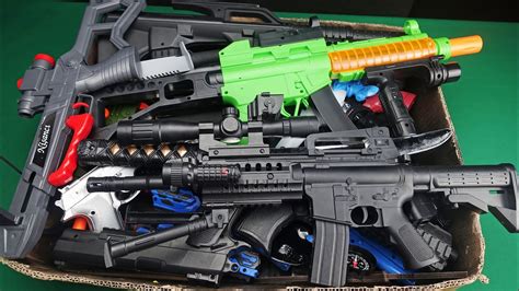 Box Full Of Realistic Rifles And Colorful Military Toys Guns YouTube