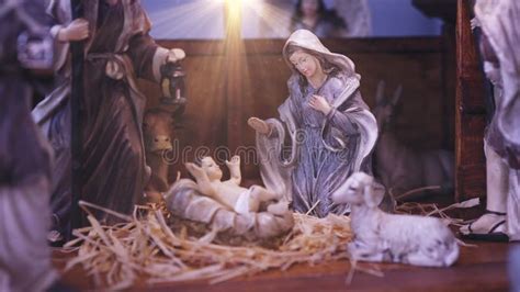 Jesus Christ Nativity Scene With Figurines In Stable And Light