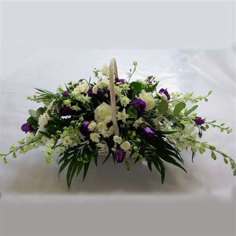 These funeral flowers boast an array of colorful plants and greenery and come in a basket or decorative vessel. funeral flowers baskets