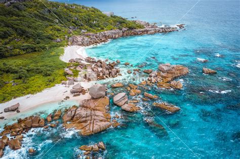 Aerial View Of Seychelles Tropical Marron Beach At La Digue Island White Sand Beach With