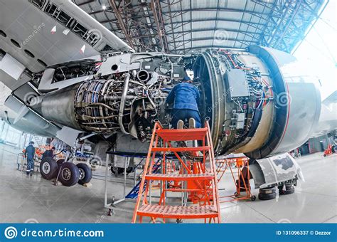 Airplane Mechanic Diagnose Repairs Jet Engine Through Open