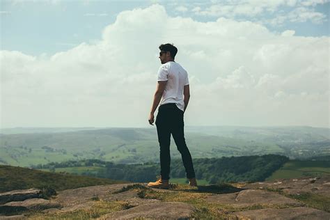 Hd Wallpaper Man Standing On Bolder Overlooking The Hills And