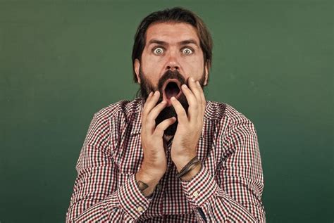 Premium Photo Scared Male Hipster Having Surprised Face With Beard And Moustache Horror
