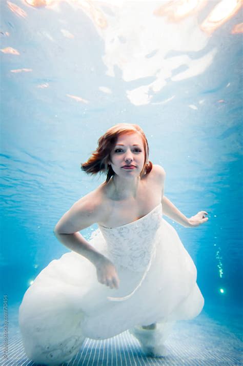 Trash The Dress Underwater Bride Swimming In Wedding Dress Facing