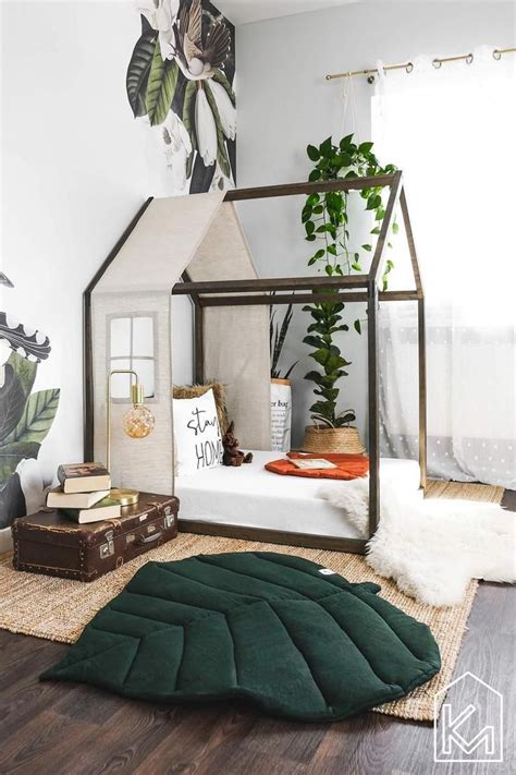 A Bedroom With A Bed Rug And Plants