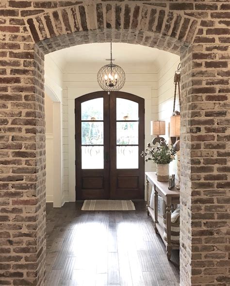 Once upon a time, the fireplace was your typical outdated brick variety with a teeny weeny little mantel. Interior brick arch and fireplace - The Refined Farmhouse