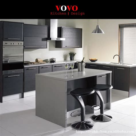 Matte Grey Lacquer Kitchen Cabinet With An Extended Island For