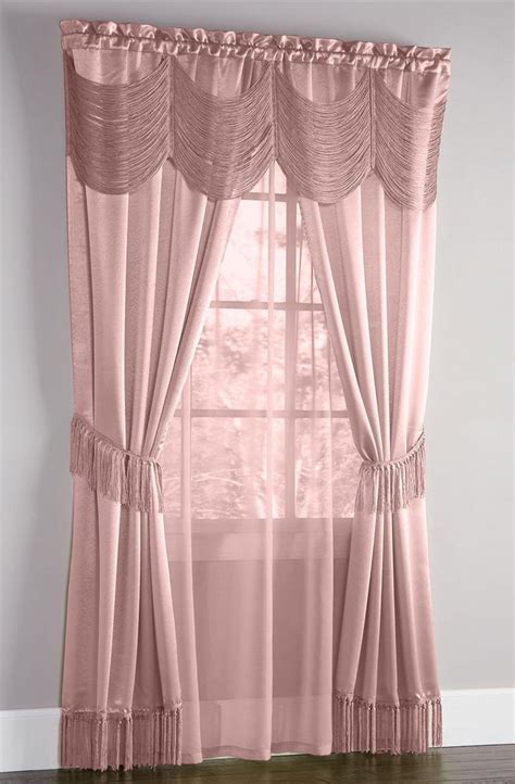 Finished in a plain mauve design, this pair of montana curtains have been made with a modern eyelet heading perfect for creating elegant folds suitable to compliment any room within your home. Halley Complete Curtain Set Mauve Achim - Draperies