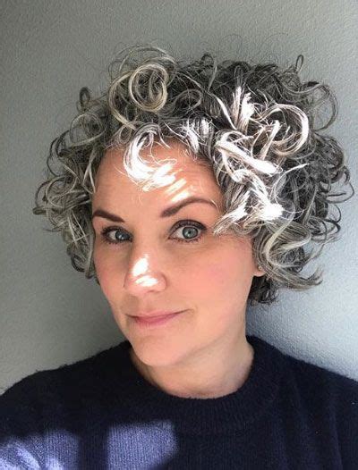 The hair on top is textured with subtle curls which gives the style this grey color is darker than the last one we shown you and it creates more of a statement look. grey curly hairstyle 3 - Short Hairstyles 2020