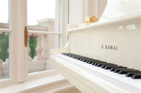 white  kawai grand piano mediterranean staircase