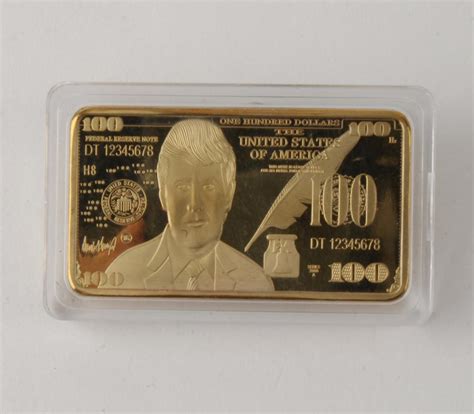 Maybe you would like to learn more about one of these? Lot - DONALD TRUMP GOLD PLATED BULLION $100 BAR