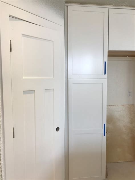 We had a cabinet shop build 2 new cabinets to add to our kitchen. White kitchen cabinets don't match white trim - stressed