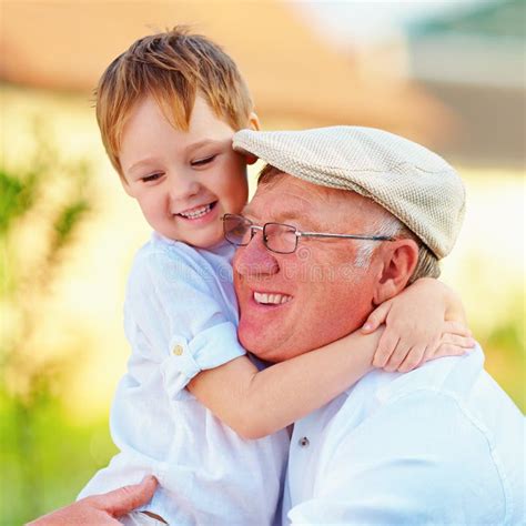 Portrait Of Happy Grandpa And Grandson Having Fun Outdoors Stock Image