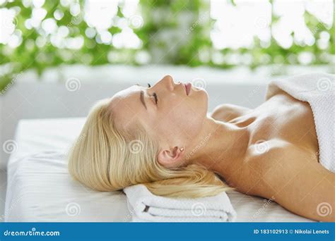 Beautiful Woman With Closed Eyes Getting A Massage In The Spa Salon Stock Image Image Of