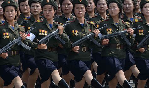 Thousands of north korean women line the roadside and wave red flower bouquets during a walk to call for peace and reunification on the korean peninsula. North Korea news - Life as woman in North Korea army ...