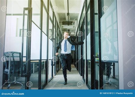 Businessman Rushing And Running On Office Hallway Stock Photo Image