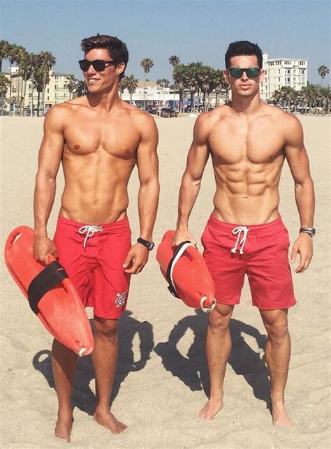 Two Handsome Shirtless Male Lifeguards