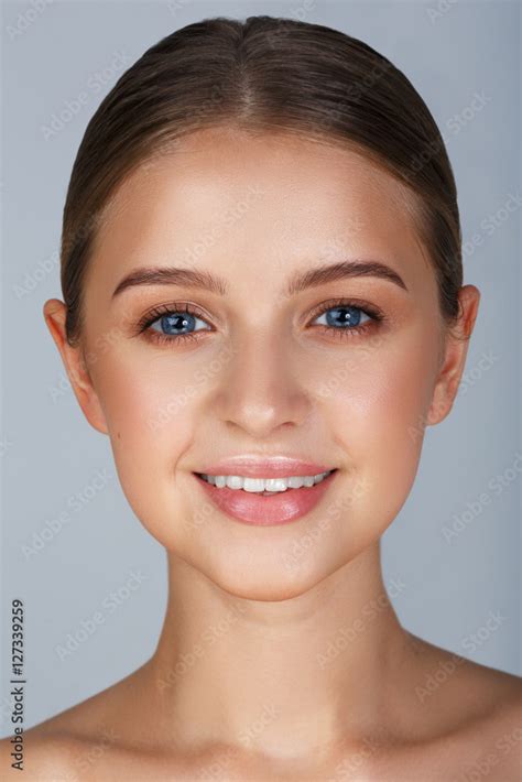 Close Up Portrait Of Sexy Smiling Young Woman With Beautiful Blue Eyes