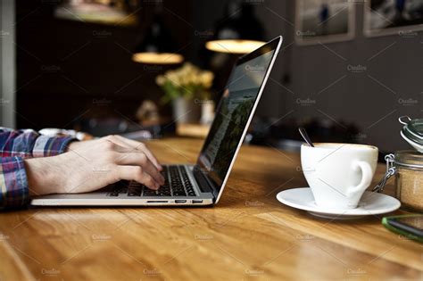 Working on Macbook Pro in the cafe | High-Quality Technology Stock Photos ~ Creative Market