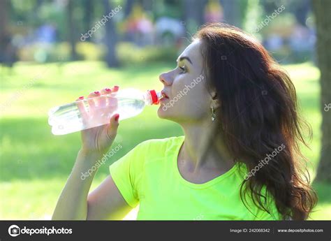 Cute Young Sporty Girl Drinking Water Bottle — Stock Photo © Olegtroino