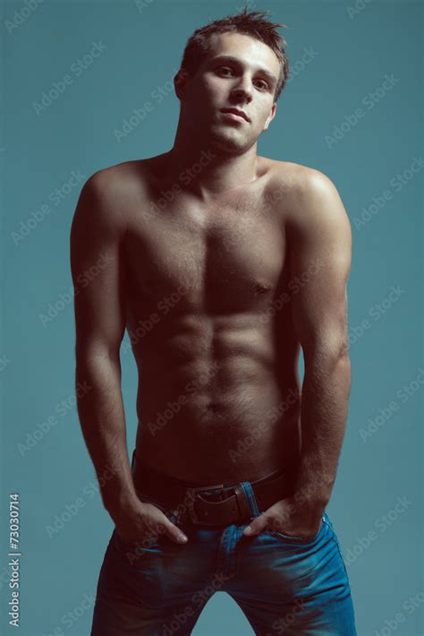 Blue Jeans Concept Handsome Muscular Male Model With Nice Abs Stock