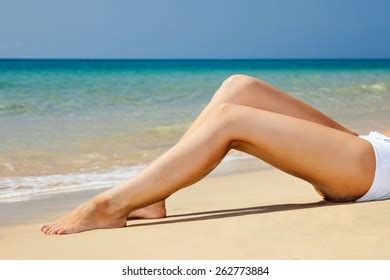 Womans Beautiful Legs On Beach Stock Photo Edit Now 262778711