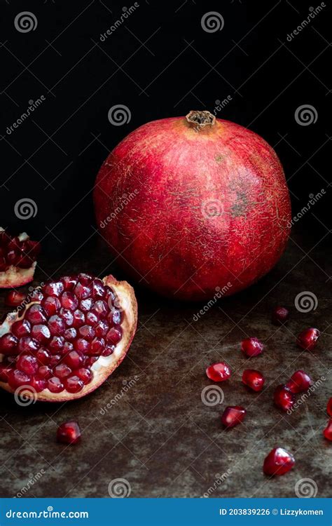 Still Life With Pomegranates On A Black Background Stock Photo Image