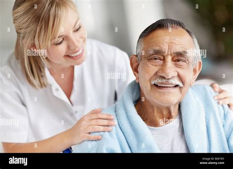 Nurse Caring For Senior Patient Stock Photo Alamy