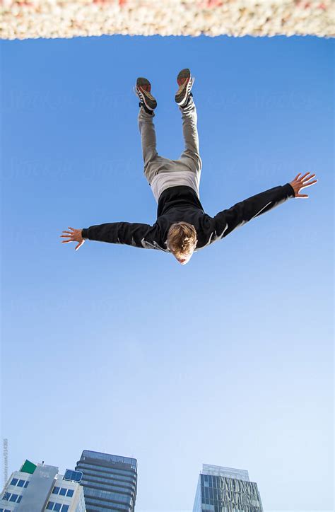 Nadir Photography Of A Man Doing A Backflip In The Air During A