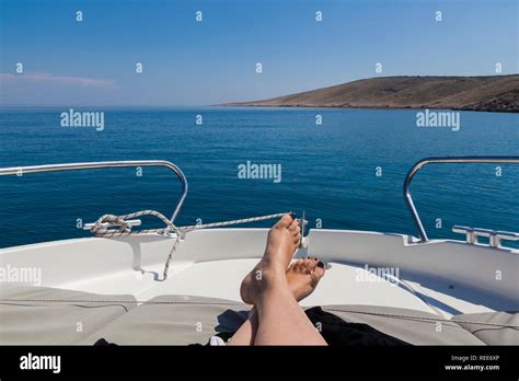 Legs Of A Young Woman Relaxing On A Boat Stock Photo Alamy
