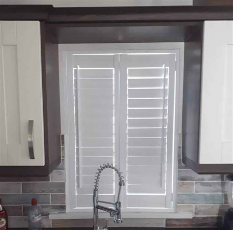 Solid wood plantation shutters by acadia shutters finish the formal dining room of this stunning new construction estate. Plantation Shutters fitted onto patio doors and a kitchen ...