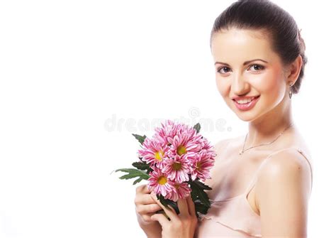 Young Beautiful Woman With Bouquet Of Pink Flowers Isolated On Stock