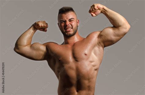 Bodybuilder Topless Flexing His Big Biceps Strong Man With Perfect