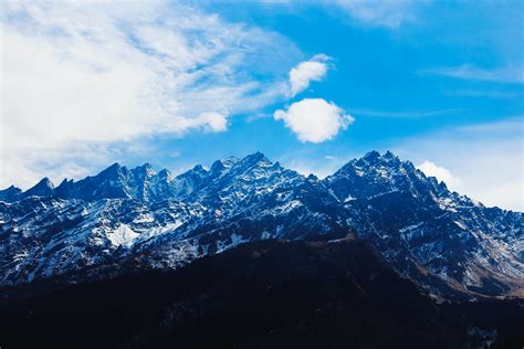 Mountain Under White Clouds At Daytime · Free Stock Photo
