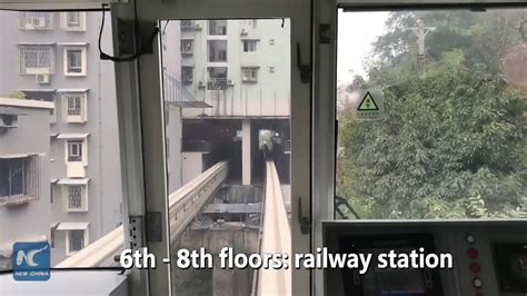 Watch This Train Passes Through Residential Building In China Youtube