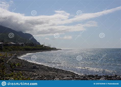 Picturesque Seashore With Rocks And Beach On A Sunny Day With Clear