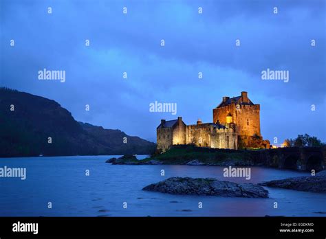 Eilean Donan Castle Illuminated In The Evening Light With Loch Duich