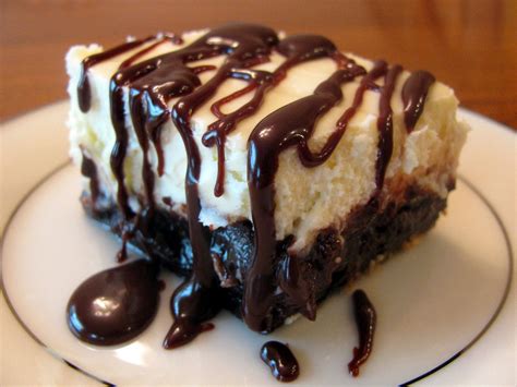 In a small saucepan over low heat melt the butter, chocolate and cocoa powder. Brownie Cheesecake