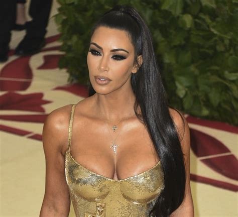 Golden Kim Kardashian In Crucifix Embellished Skin Tight Versace Dress