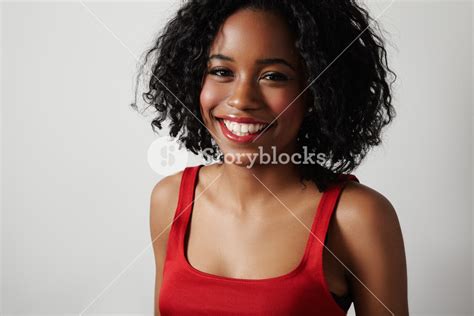 Black Woman In Red Dress With Bright Red Lips And Curly Hair Royalty