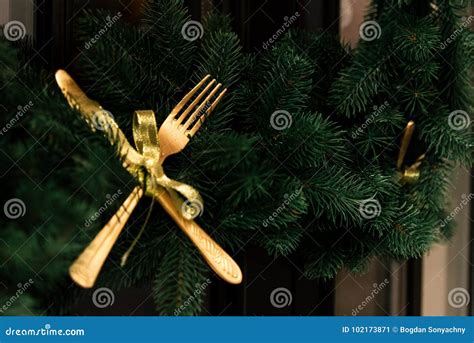 Stylish Luxury Golden Knife And Fork On Christmas Wreath Creat Stock