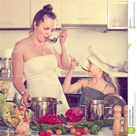 Woman And Her Daughter Preparing Veggie Food Stock Image Image Of Knife Apartment 83960525