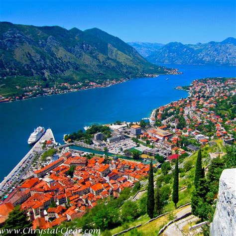 Kotor, Montenegro from atop on a summer's day. Small ship cruising with