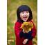 Happy Little Asian Girl Holding Gingko Leaf Smile By Bo  Stocksy United